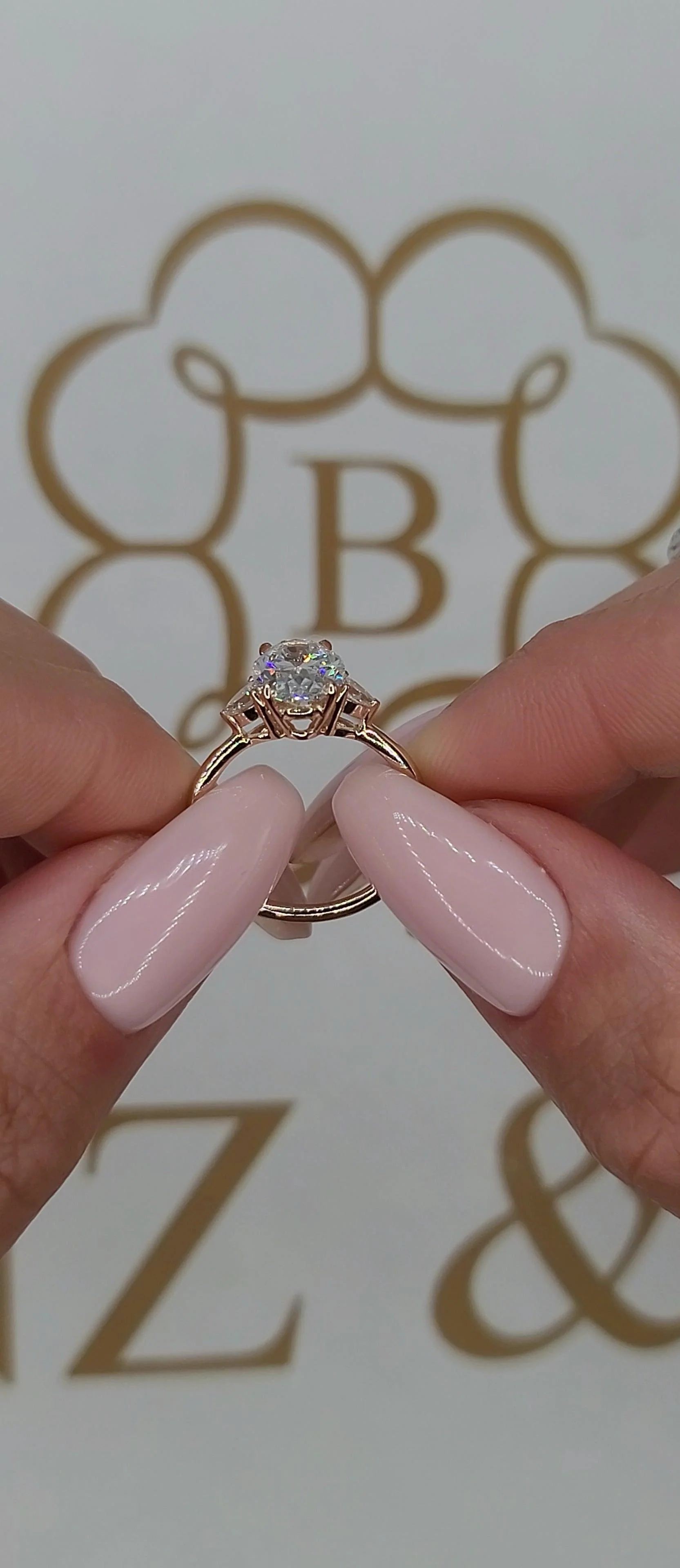 2.35 Carats Lab Grown Oval Cut with Pear Shape Side Stones Diamond Engagement Ring in Rose Gold - Image 6
